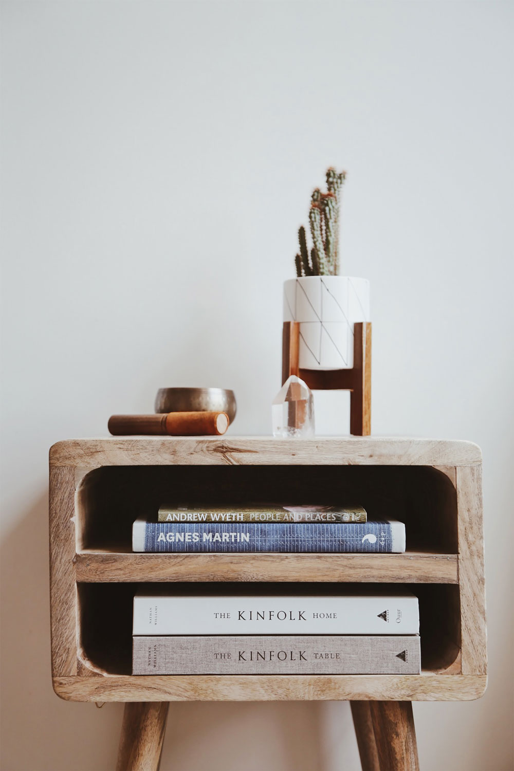 a side table with books in it