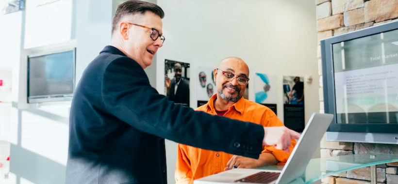 two people working on a computer