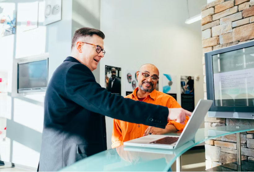 two people working on a computer