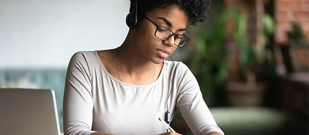 a person writing on a paper