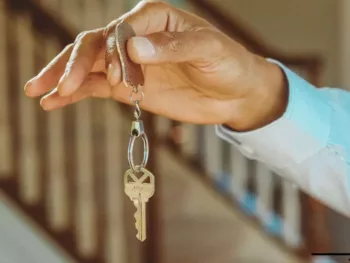 a hand holding keys to a nice rental unit