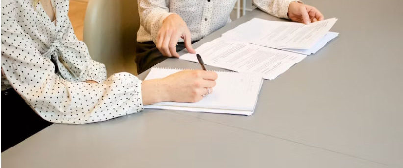 two people working on paperwork