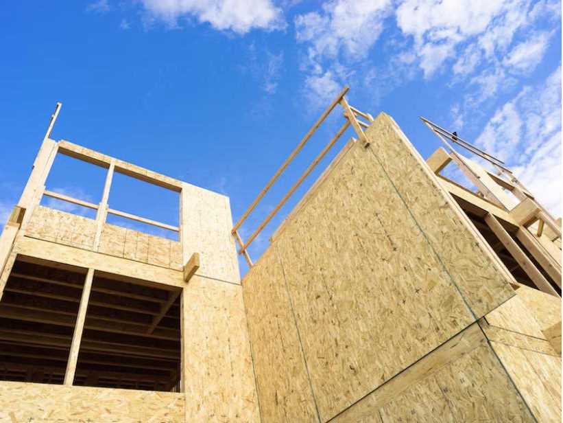 an exterior shot of a house being built