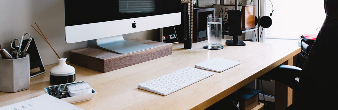 a computer that says do more on it on a desk